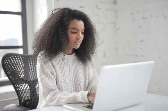 photo of woman using laptop